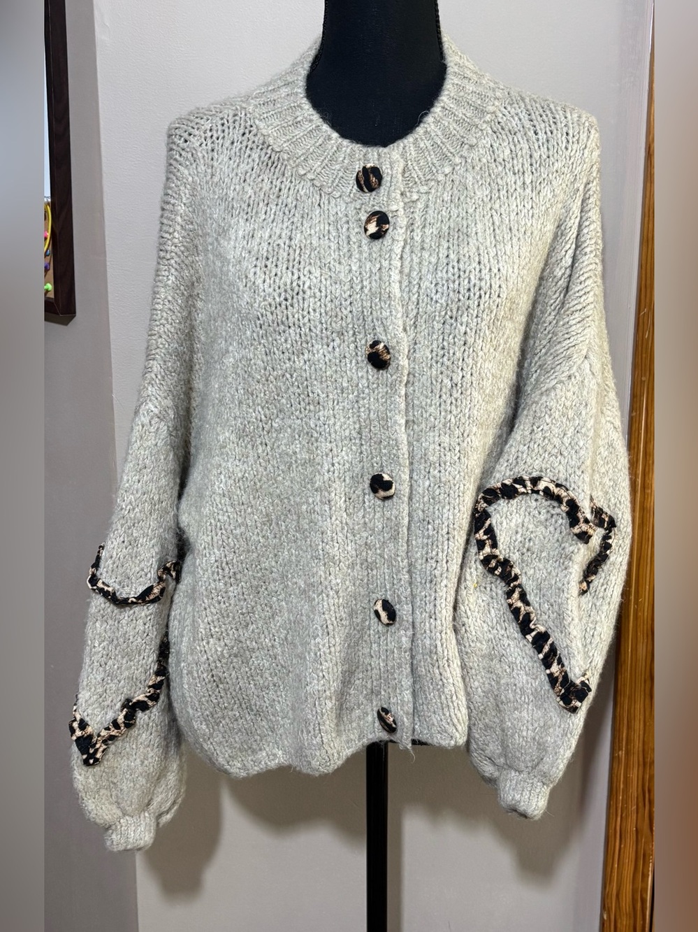 Tan cardigan with leopard print accents. One Size.  NWT.